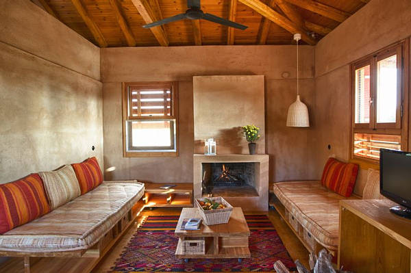 3b: This is a picture of the inside of one of our apartment houses where all materials are natural, wooden roof construction, natural colorings, natural beddings and sofas (from Cocomat), all cotton and wool linens and carpets, wooden furniture, etc